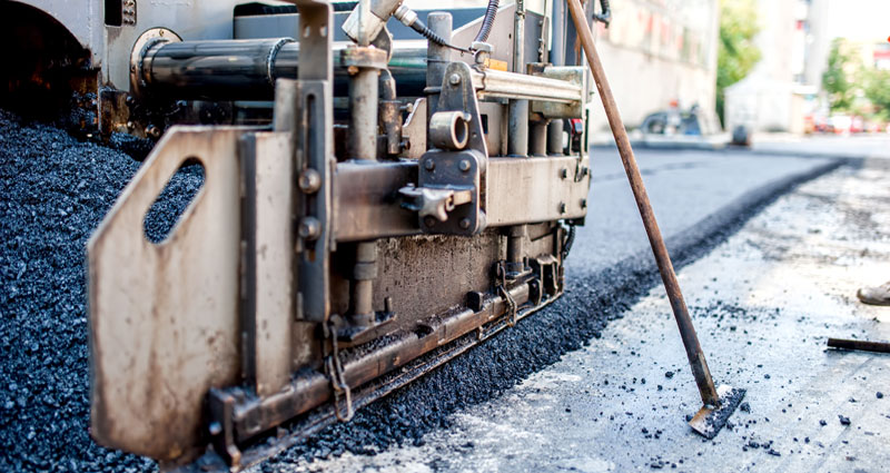 Asphalt and Paving Tampa, laying asphalt down to be pressed for a new asphalt parking lot.