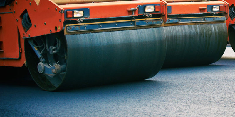 Oscillatory rollers, roll over and flatten asphalt in Tampa, to create a new asphalt road in Tampa